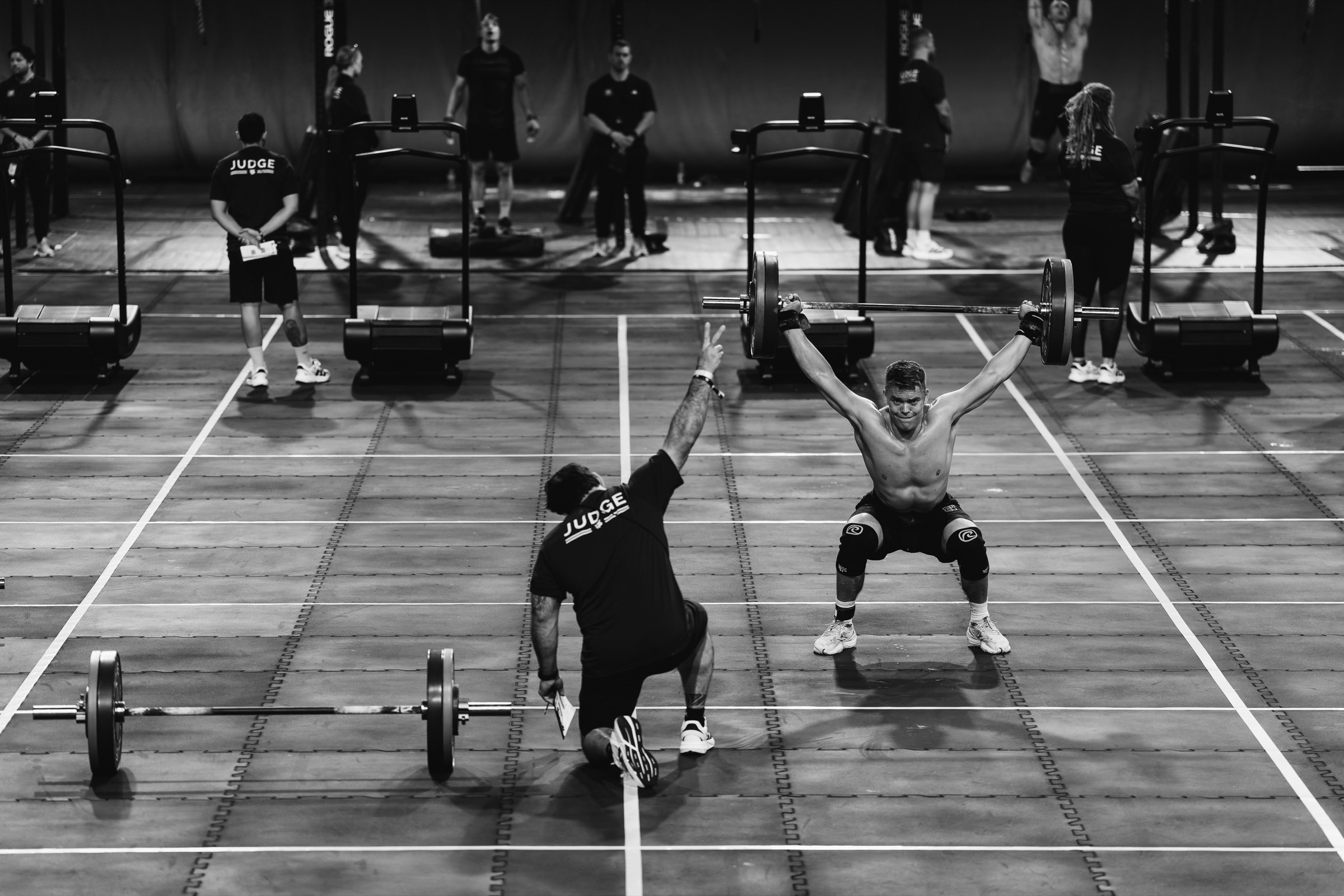 Kriger athlete hitting an overhead squat on the competition floor