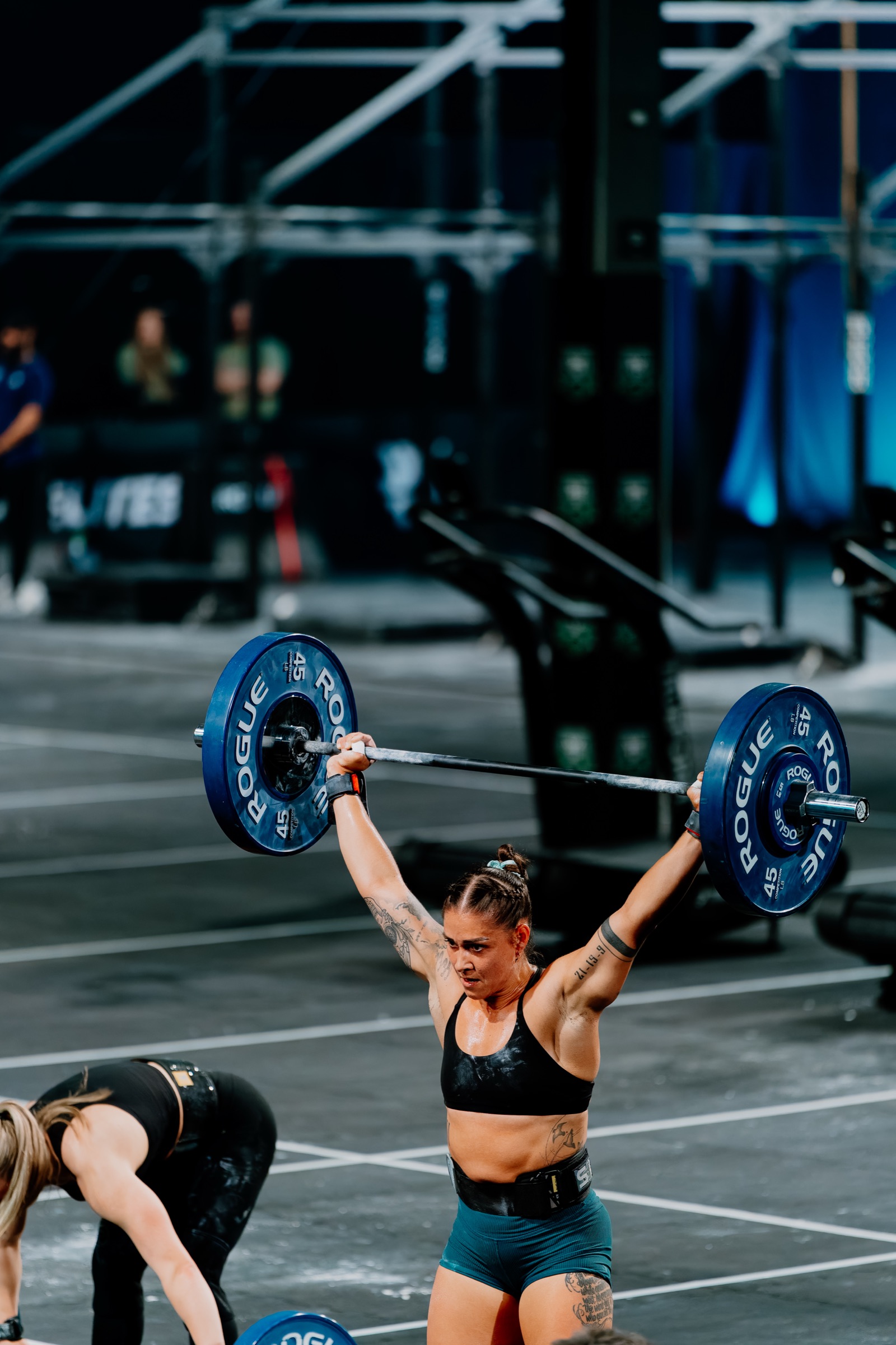 Kriger athletes with barbells overhead in competition